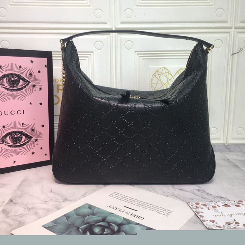 G*u*i top handle bags